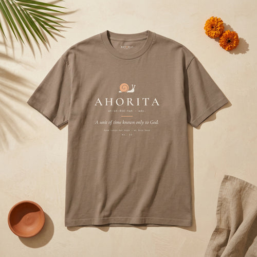 AHORITA Palabra Tee in Faded Brown: garment-dyed heavyweight cotton tee printed with a snail and the line “A unit of time known only to God.”