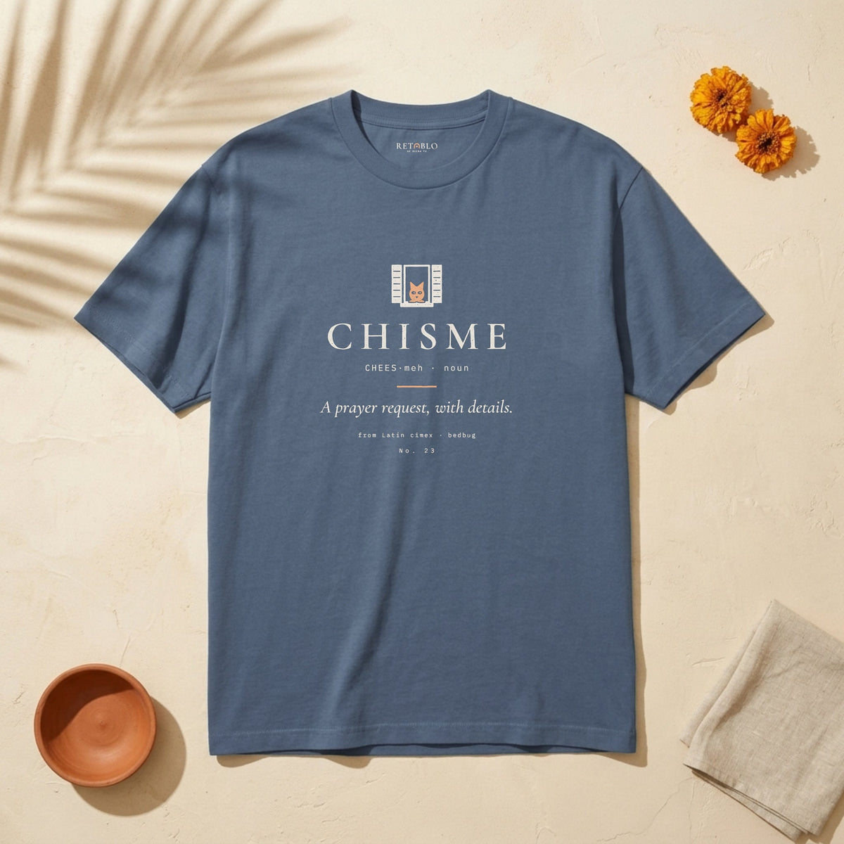 CHISME Palabra Tee in Faded Navy: garment-dyed heavyweight cotton tee printed with a cat at the window and the line “A prayer request, with details.”